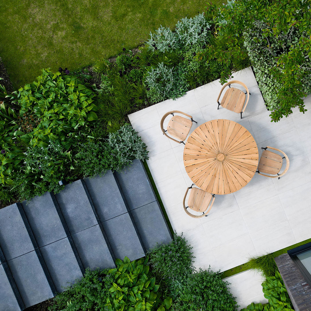 Birdseye view of Stuart Charles Towner designed garden dining area in Hampshire.